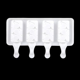 White plastic ice cream mold on a stick, suitable for making frozen treats.
