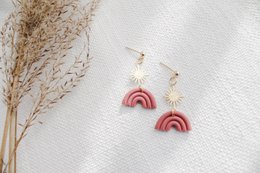  Terracotta statement earrings with a rainbow design, featuring a warm, earthy color palette.