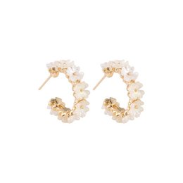 Gold-tone hoop earrings with floral accents. Delicate and feminine design.