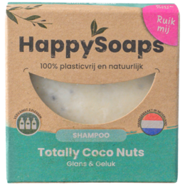 A round, white shampoo bar with the text "Happy Soaps" embossed on it. The bar is packaged in a simple cardboard box.