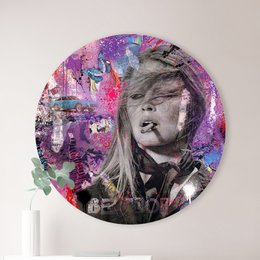 A round wall art piece featuring a portrait of Brigitte Bardot with a colorful, abstract background. The product is available in three different sizes: 40 cm, 60 cm, and 80 cm in diameter.