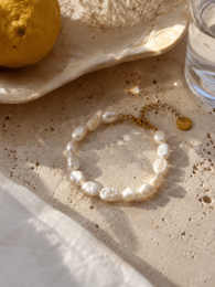 White baroque pearl bracelet, elastic beaded jewelry, minimalist coastal style accessory.