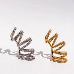 Polsino auricolare avvolgente con pavé geometrico