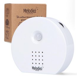  White round music box with speaker, soothing melodies for babies and nursery relaxation.