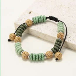 Bracelets made of round and flat beads in natural lava stone in shades of green.