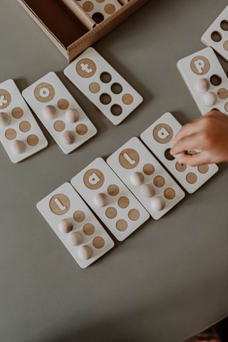 Braille and latin alphabet, wooden toy, different languages