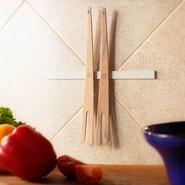 Wooden salad forks with magnetic handles, suitable for serving salads.
