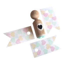 Small wooden heart-shaped stamp with a heart-shaped design.