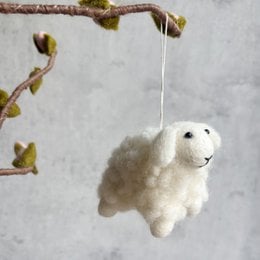 Soft, fluffy white sheep ornament for Easter decoration.