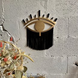 Occhio decorativo in legno e filo di cotone