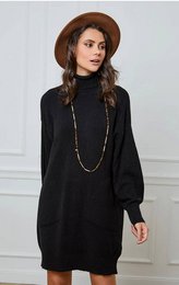 A black knit dress with a high collar and long sleeves. The dress has a relaxed, oversized fit and is available in a variety of colors including green, orange, navy, and black.