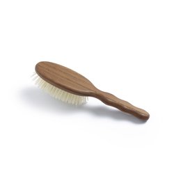 Small white bristle hair brush with wooden handle. Oval shape, natural bristles for gentle hair brushing.