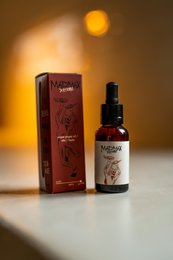 Madmax Xtreme olive oil, dark glass bottle with red label, dropper bottle, premium quality, natural ingredients.