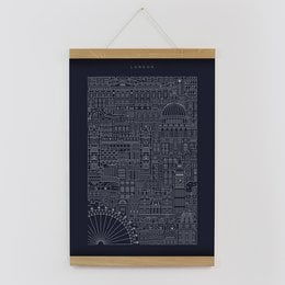 A black and white print featuring a detailed cityscape design with various architectural elements and geometric shapes.