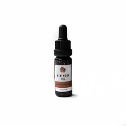 New Moon Diffuser Oil Blend, an essential oil blend in a dark glass bottle with a dropper. The blend is designed for use in essential oil diffusers to create a calming, relaxing atmosphere.