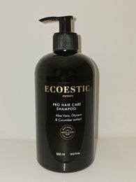 Eco-friendly shampoo with Nordic Swan label, featuring a black bottle with a pump dispenser. The shampoo is designed for hair care and contains natural ingredients.