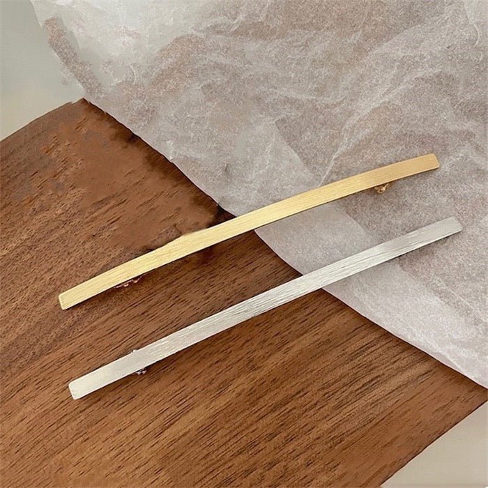 Minimalistyczna, jednoliniowa metalowa spinka do włosów