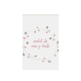 Gift tag with text "Because I'm thinking of you" and decorative floral wreath design.