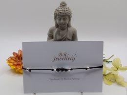 Sardonyx gemstone bracelet, available in various metal finishes including silver, gold, and rose gold. The bracelet features a simple, elegant design with a charm or pendant.