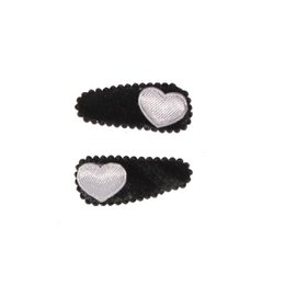 Black hair clips with heart-shaped white accents. Suitable for children's hair accessories.