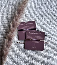  Precious birthstone bracelet in July's birthstone color, amethyst. Features delicate beads and a dainty design.
