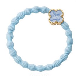 Light blue hair elastic with four-leaf clover charm, textured fabric scrunchie.