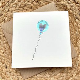 Blue heart-shaped balloon with baby design, suitable for baby cards or baby shower.