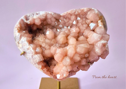 A heart-shaped greeting card made of pink amethyst gemstone, perfect for expressing love and affection.