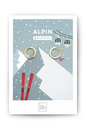 Stud earrings in gold and silver with a minimalist alpine design. Features a circular shape and a simple, elegant style.