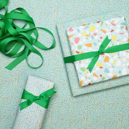 Colorful wrapping paper turquoise with terrazzo pattern, children pack gifts for children's birthday, for school or at birth