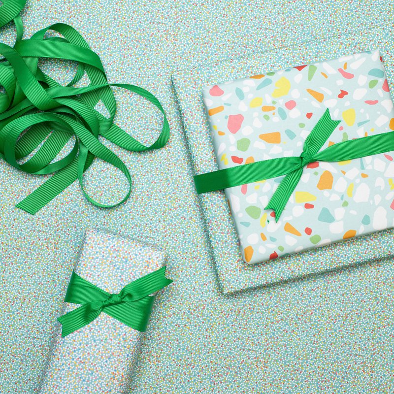 Colorful wrapping paper turquoise with terrazzo pattern, children pack gifts for children's birthday, for school or at birth