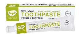 Green toothpaste with fennel and propolis, natural ingredients for oral care.