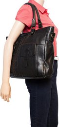 Black ladies bag or shoulder bag made of braided leather handles and