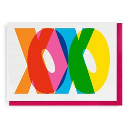 Colorful greeting card with the text "XOXO" in a bold, abstract design. The card features a vibrant mix of orange, red, blue, green, and pink shapes, creating a playful and eye-catching visual.