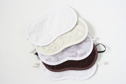 Lace sleep mask in white, pink, white flower, brown, ecru, and lilac colors. Soft, comfortable fabric for a restful sleep.