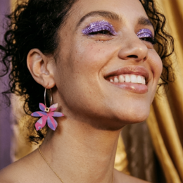 Purple and pink flower hoop earrings, mismatched asymmetrical design, colorful floral charms, statement jewelry.