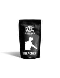 Dark roasted coffee beans in a black package with a white silhouette of a person and the text "BREACHER".