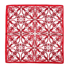 Red ornamental floral patterned scarf with intricate geometric botanical design.