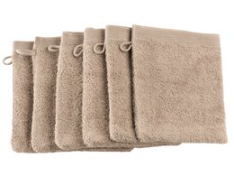 Beige washcloth made of soft, absorbent material. Rectangular shape with loop for hanging.
