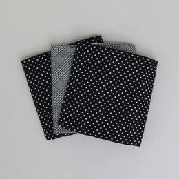 Black and white patterned handkerchiefs, suitable for use as pocket squares. The handkerchiefs feature a variety of polka dot and checkered designs in a classic monochrome color scheme.