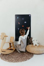 Rectangular magnetic board for children's room, made of wood, with a simple, minimalist design. Suitable for displaying artwork, notes, and more.