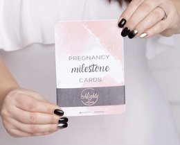 Pregnancy milestone cards featuring various designs and text such as "We're having a baby", "Today's the day", and "Baby shower". The cards are made of high-quality materials and are suitable for documenting and celebrating pregnancy milestones.