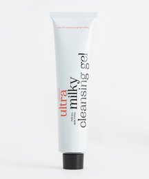 A white tube of Milky Cleansing Gel 200ml, a facial cleanser product. The product is packaged in a simple, minimalist design with the brand name and product name clearly visible.