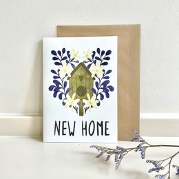 New home greeting card with floral design and text "New Home"