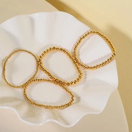 Aquilea – Armbandstapel aus Goldperlen
