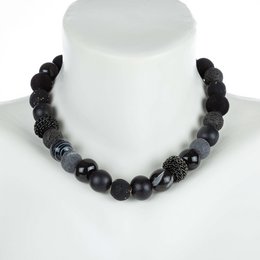 This necklace features a mix of black beads, including lava stones, onyx, and glass beads. The necklace has a stylish and bold design, perfect for adding a touch of elegance to any outfit. The necklace is available in two sizes, 16 mm and 20 mm, to suit different preferences.