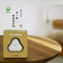 Ceramic figurine with a pear-shaped design, featuring a green leaf icon and text "Kagen" on the packaging. The figurine appears to be a decorative or functional item, potentially for use with hot water.