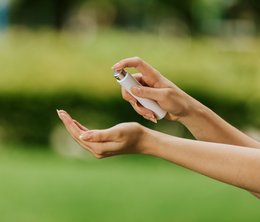 Refillable pocket-sized hand sanitizer sprayer available in black and white colors.