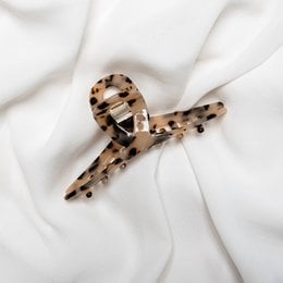 Tortoiseshell hair claw clip with a twisted design, suitable for holding and styling medium to long hair.
