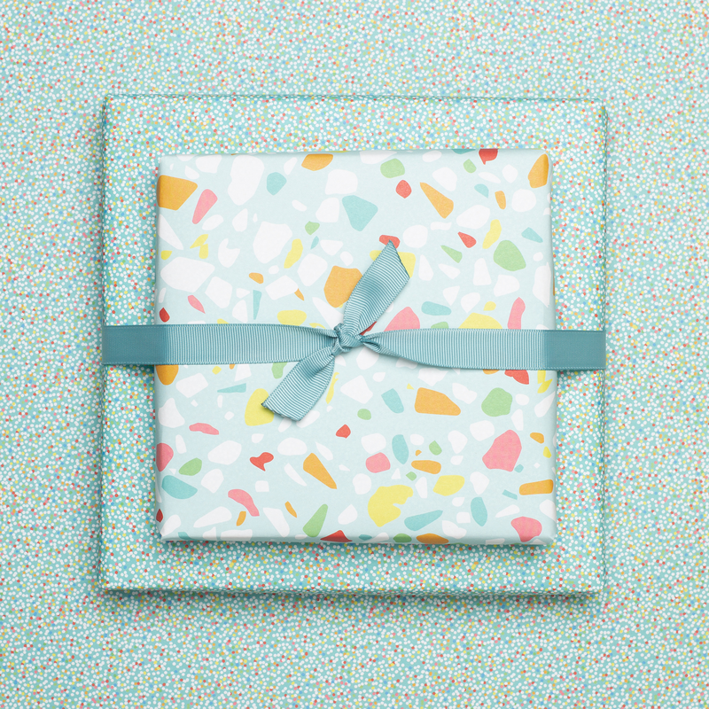 Colorful wrapping paper turquoise with terrazzo pattern, children pack gifts for children's birthday, for school or at birth